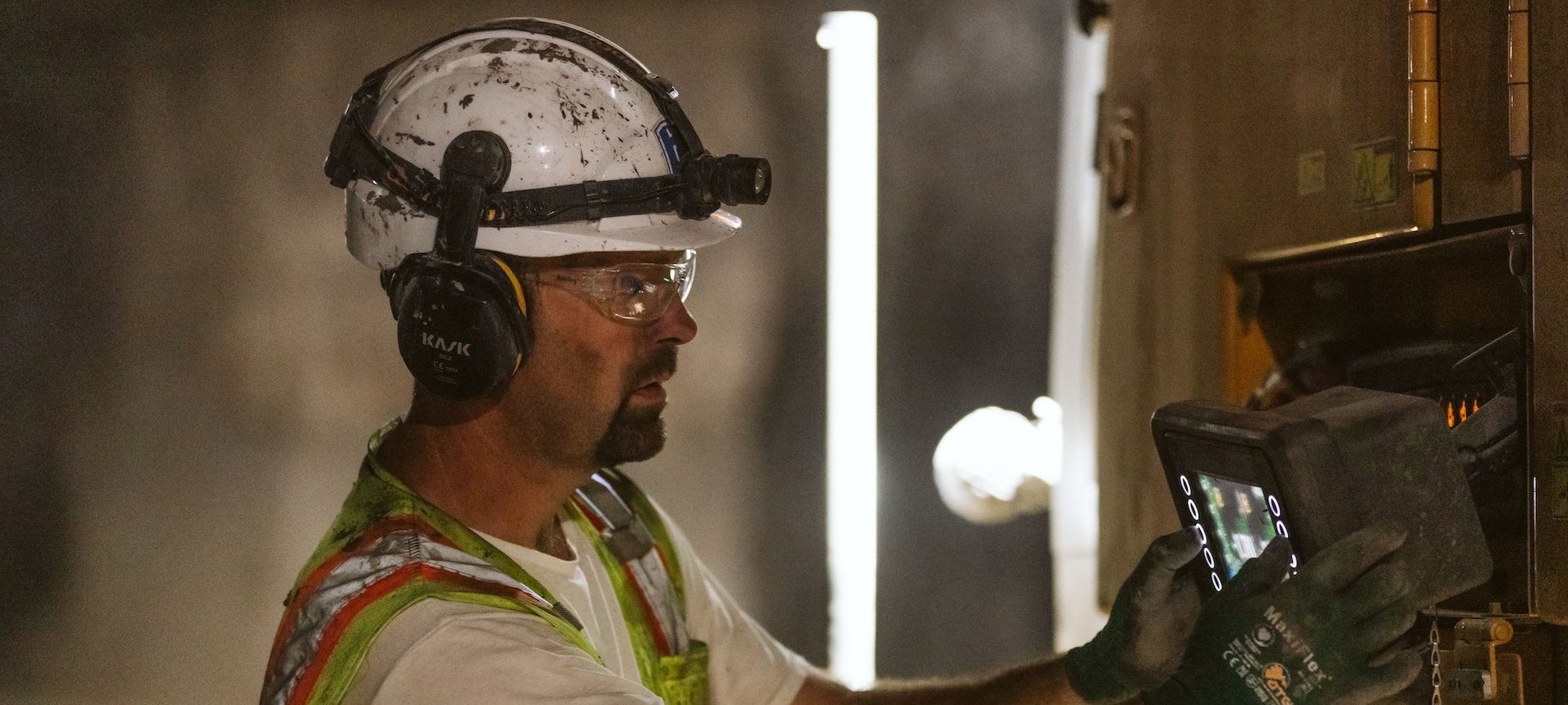 Luke Stevens operates equipment in an industrial setting while wearing protective gear.